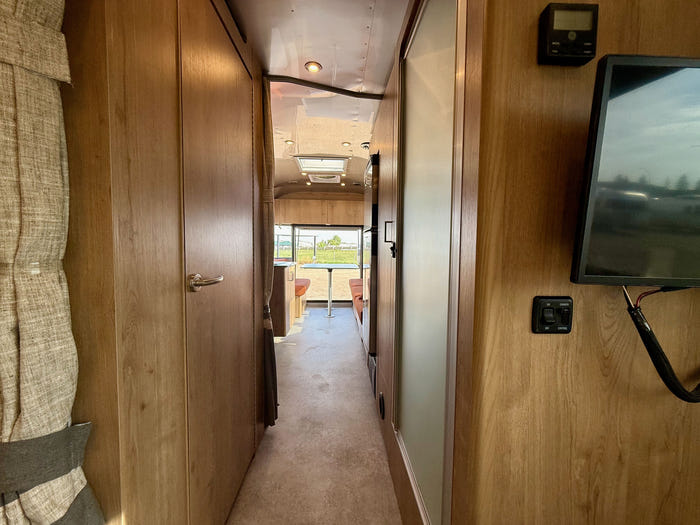 
Used 2024 Airstream Trade Wind 25FB Travel Trailer - Terracotta Exterior - River Oak Interior - VIN: 1STJVYJ27RJ573006 - Stock #RP1005
