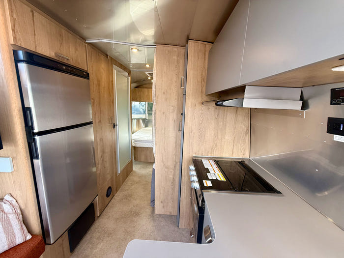 
Used 2024 Airstream Trade Wind 25FB Travel Trailer - Terracotta Exterior - River Oak Interior - VIN: 1STJVYJ27RJ573006 - Stock #RP1005