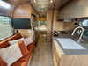 
Used 2024 Airstream Trade Wind 25FB Travel Trailer - Terracotta Exterior - River Oak Interior - VIN: 1STJVYJ27RJ573006 - Stock #RP1005