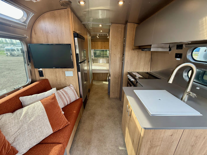 
Used 2024 Airstream Trade Wind 25FB Travel Trailer - Terracotta Exterior - River Oak Interior - VIN: 1STJVYJ27RJ573006 - Stock #RP1005