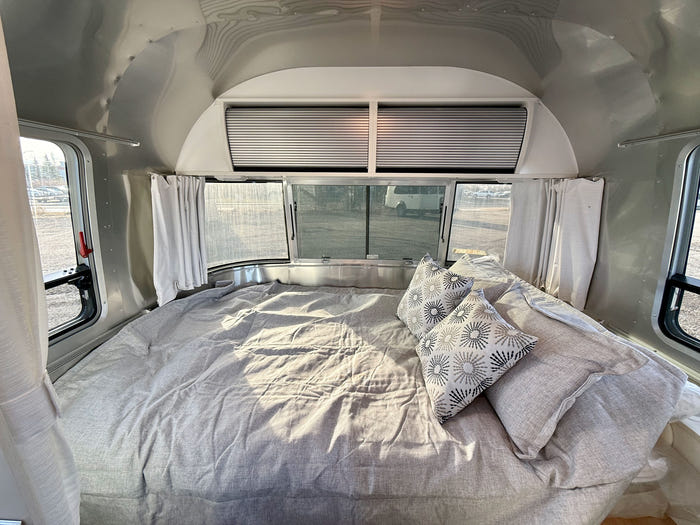 
New 2026 Airstream Bambi 22FB Travel Trailer - Ocean Exterior - White Cypress Interior - VIN: 1STVMAF10TJ577188 - Stock #R60004