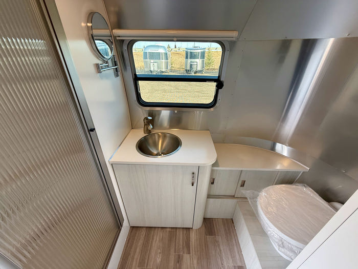 
New 2026 Airstream Bambi 22FB Travel Trailer - Ocean Exterior - White Cypress Interior - VIN: 1STVMAF10TJ577188 - Stock #R60004