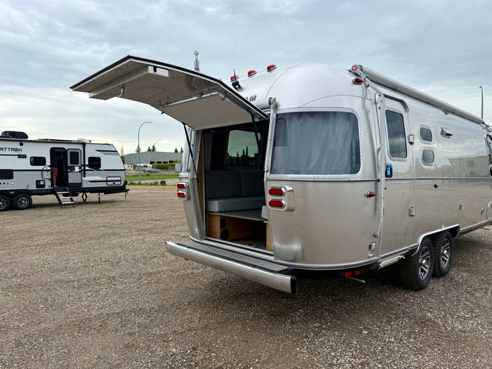 
New 2026 Airstream Trade Wind 25FBT Travel Trailer - Fieldstone Exterior - River Oak Interior - VIN: 1STJVYJ25TJ579989 - Stock #R60029