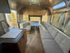 
New 2026 Airstream Trade Wind 25FBT Travel Trailer - Fieldstone Exterior - River Oak Interior - VIN: 1STJVYJ25TJ579989 - Stock #R60029