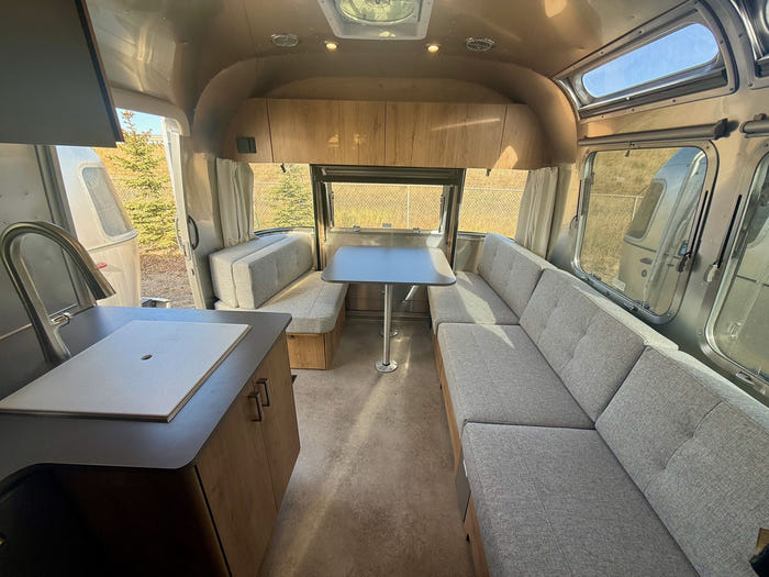 
New 2026 Airstream Trade Wind 25FBT Travel Trailer - Fieldstone Exterior - River Oak Interior - VIN: 1STJVYJ25TJ579989 - Stock #R60029