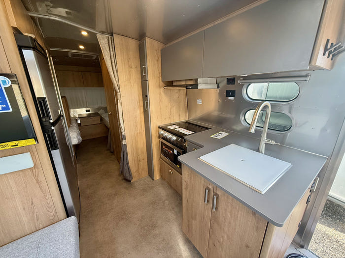 
New 2026 Airstream Trade Wind 25FBT Travel Trailer - Fieldstone Exterior - River Oak Interior - VIN: 1STJVYJ25TJ579989 - Stock #R60029