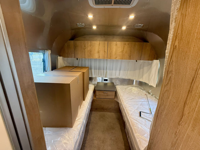 
New 2026 Airstream Trade Wind 25FBT Travel Trailer - Fieldstone Exterior - River Oak Interior - VIN: 1STJVYJ25TJ579989 - Stock #R60029