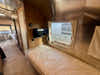 
New 2026 Airstream Trade Wind 25FBT Travel Trailer - Fieldstone Exterior - River Oak Interior - VIN: 1STJVYJ25TJ579989 - Stock #R60029