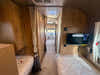
New 2026 Airstream Trade Wind 25FBT Travel Trailer - Fieldstone Exterior - River Oak Interior - VIN: 1STJVYJ25TJ579989 - Stock #R60029